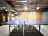 Ping pong table located downstairs.