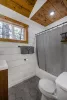 Full size bathroom with hot water on demand and a deep bathtub for soaking.
