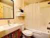 Full bathroom with tub and shower.