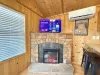 Television and fireplace in the living room.