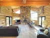 Enjoy the natural light in the living room with seating to relax during your stay.