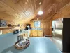 Kitchen with ladder to the loft area.