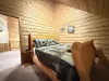 Queen size bed located upstairs.