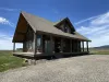 A large driveway leads up to the cabin to be able to park all your vehicles.