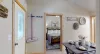 Outside of the bedroom is the main living area and kitchen.