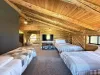 Beds are located facing a tv for entertainment.