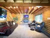 Living room with seating and smart tv for entertainment. Fireplace is also located here to cozy up by the fire.
