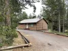 Large driveway and landscape.