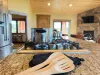 Basic cooking essentials with pots and pans, dishes, silverware, and small appliances.