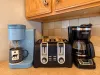 Keurig and standard drip coffee maker and a 4 slot toaster.