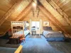 Upstairs loft with a Full bed, and 2 twins on the bunkbed.