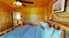 Bedroom #2 located on the main floor with a Queen size bed.