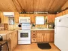 Full kitchen with appliances, cookware, dishes, silverware, and basic spices.