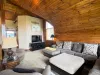 Unwind in the expansive upstairs loft, boasting a massive sectional sofa and a dedicated TV area—perfect for group movie nights.