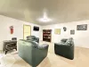 Spacious seating area with games and a tv.