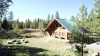 view of the fire pit in front of the cabin.