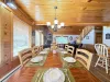 Dining table with seating for up to 8 people with 6 additional seats at the kitchen island.