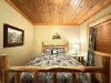 Bedroom #3 located in the basement with a queen bed right off the living room.