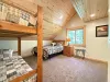 Bedroom #2 located upstairs with a Queen and a bunk bed.