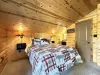 Bedroom #3 located upstairs with a Queen size bed. A closet is located in this room to store your belongings.