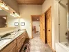 The bathroom where rustic charm meets spa-like comfort.
