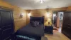 Bedroom #5 on the main level with a Queen size bed. Storage is provided in the closet for your belongings during your stay.