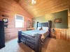 A double bed is located in the first bedroom upstairs.