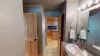Shared downstairs bathroom with shower tub combo, toilet, and sink vanity.