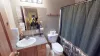 The master bathroom with plenty of storage as well as a vanity sink, toilet, and shower tub combo. Relax in this bathroom after a long day.