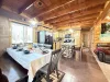 The open kitchen blends seamlessly into the cabin's cozy living area, creating a welcoming space perfect for gathering and unwinding.