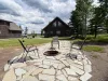 Gather around the stone fire pit during the day to plan your next adventure, surrounded by stunning open nature.