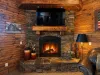 Cozy up by the easy-to-use propane fireplace—no wood needed! Unwind on the plush leather sofa for a warm, relaxing evening.