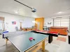 Enjoy a variety of games in this massive recreation space, beautifully set up with premium tables and plenty of room for everyone.