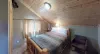 Bedroom #3 located upstairs with a Queen size bed.