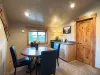 Enjoy light meals or snacks at the round dining table, conveniently complete with a handy wet bar kitchenette and mini-fridge.