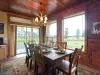 Enjoy meals under the warm glow of the unique antler chandelier, surrounded by large windows that look out onto the beautiful scenery.