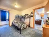 Main level private bedroom. Bunkbed with full lower bed and twin upper.