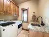 Laundry room with washer and dryer. Laundry soap is provided.