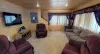 Living room with seating and tv to relax in the cabin.