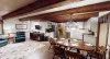 Upon entrance you are greeted by the dining area, living room, and kitchen.