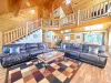 The open kitchen blends seamlessly into the cabin's cozy living area, creating a welcoming space perfect for gathering and unwinding.
