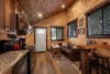 The living room with seating and tv for entertainment.