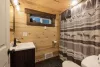 Full size bathroom with hot water on demand and a deep bathtub for soaking.