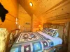 A private mountain sanctuary—perfectly combining rustic log cabin charm with premium comfort, highlighted by an authentic wilderness patchwork quilt.