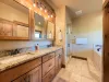 Ensuite Master bathroom with double vanity and standing shower.