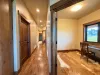 The hallway leads to the office, bathroom, bedrooms and laundry room and out to the garage.