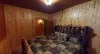 Bedroom #4 located in the basement with a King size bed.