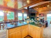 The open-concept kitchen looks out into the dining area and living room, keeping everyone connected during meal prep and family time.