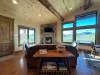 Living room with seating, fireplace, and tv.