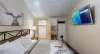Relax after a long day in this bedroom that brings a mix of modern amenities with a rustic feel.